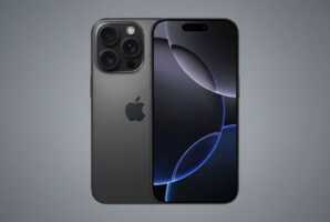 Un smartphone posé sur un fond gris.