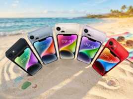 Plusieurs smartphones de différentes couleurs disposés en éventail sur une plage de sable.
